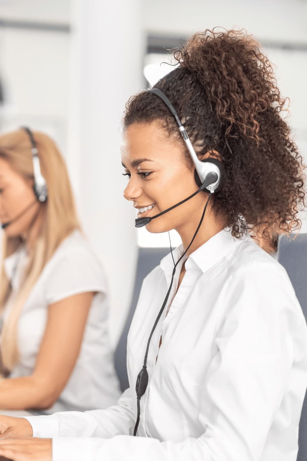 A call handler taking a patient call on a headset