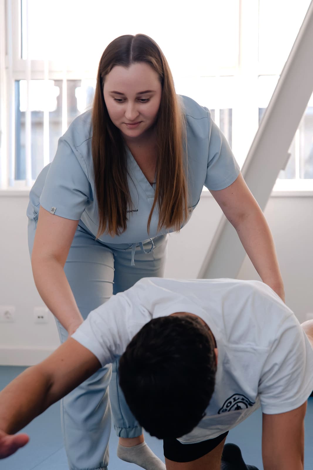 Physiotherapist treating a patient